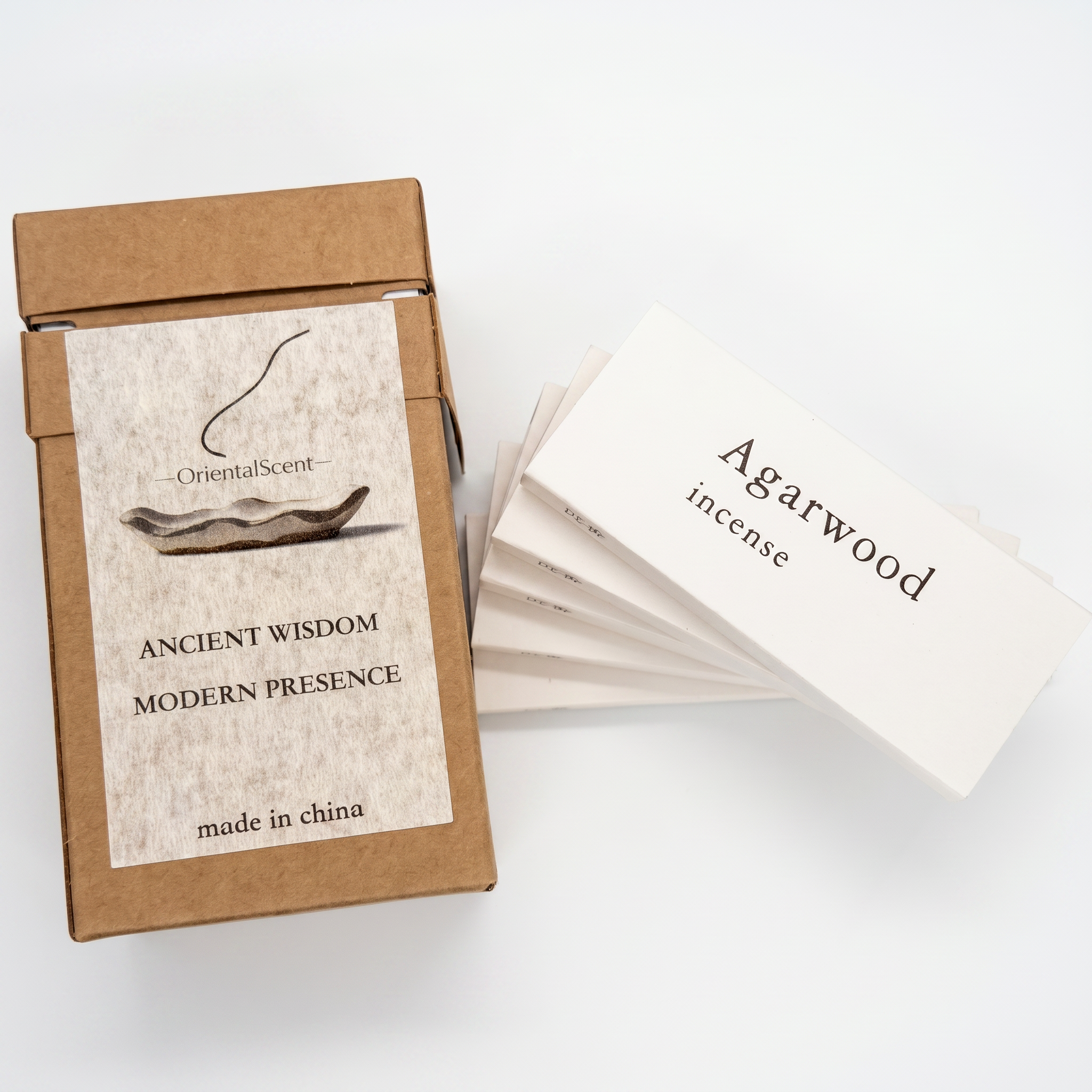 Agarwood (Oudh) Incense Set — Deep & Grounding — lifestyle photo showing incense burning with smoke trail — handcrafted natural incense by OrientalScent